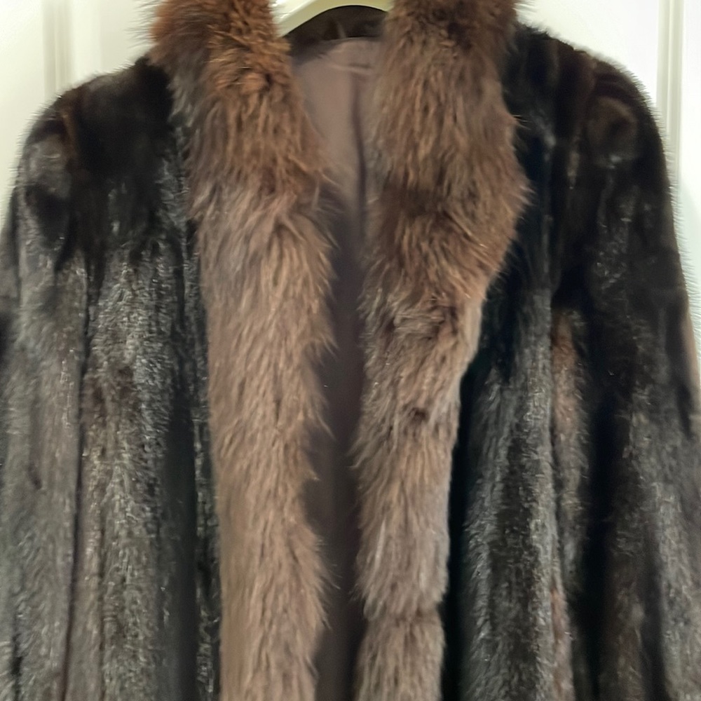 Full length dark brown mink coat.